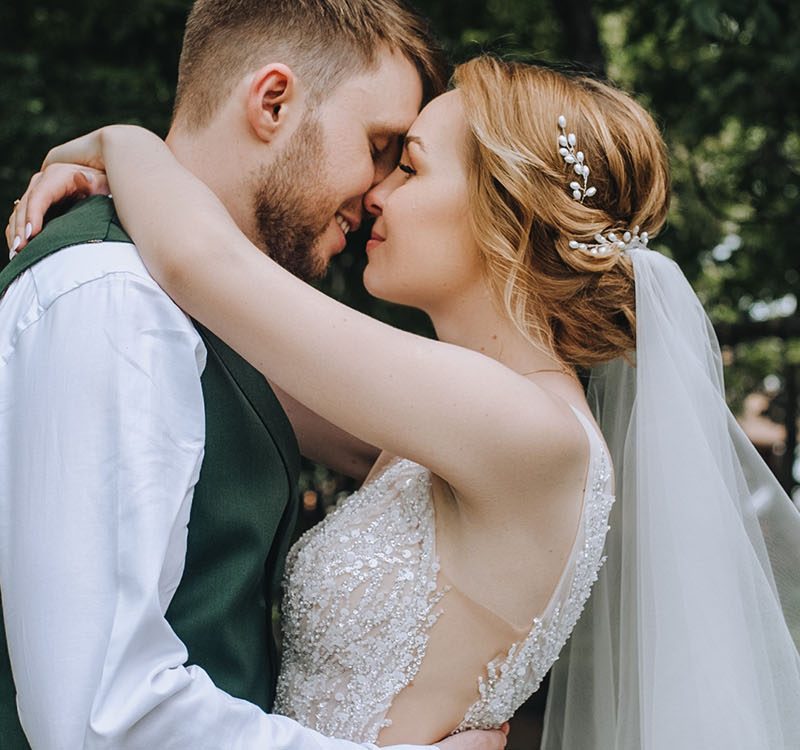 A bride and groom embracing