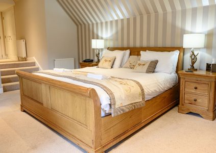 A Junior Suite at the Glen Clova Hotel with a cosy double bed