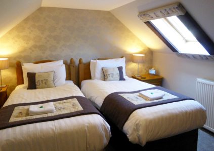 Twin beds in hotel room