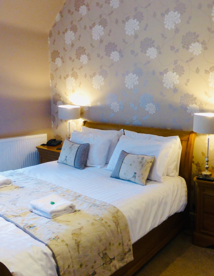 Bed in superior room at Glen Clova in Scotland