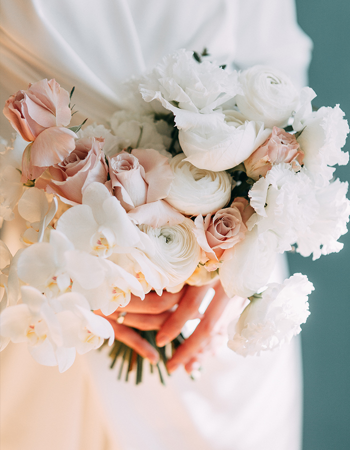 A bride holding her bouquet of flowers