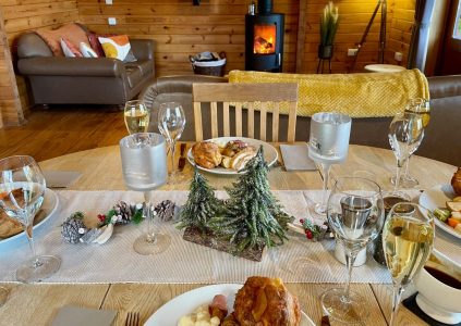 Christmas dinner on a festive break in our luxury lodges snuggled it the Highland glens.