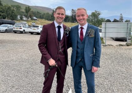 Two grooms away to get married with their Westie at dog-friendly wedding