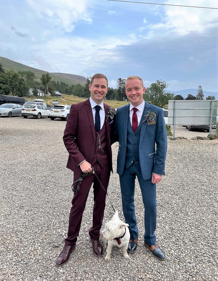 Two grooms away to get married with their Westie at dog-friendly wedding