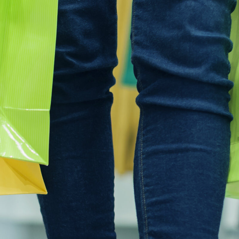 Woman with colourful shopping bags